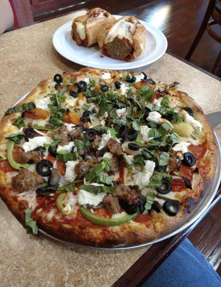 A vegetable-topped pizza served at Main Street Pizza